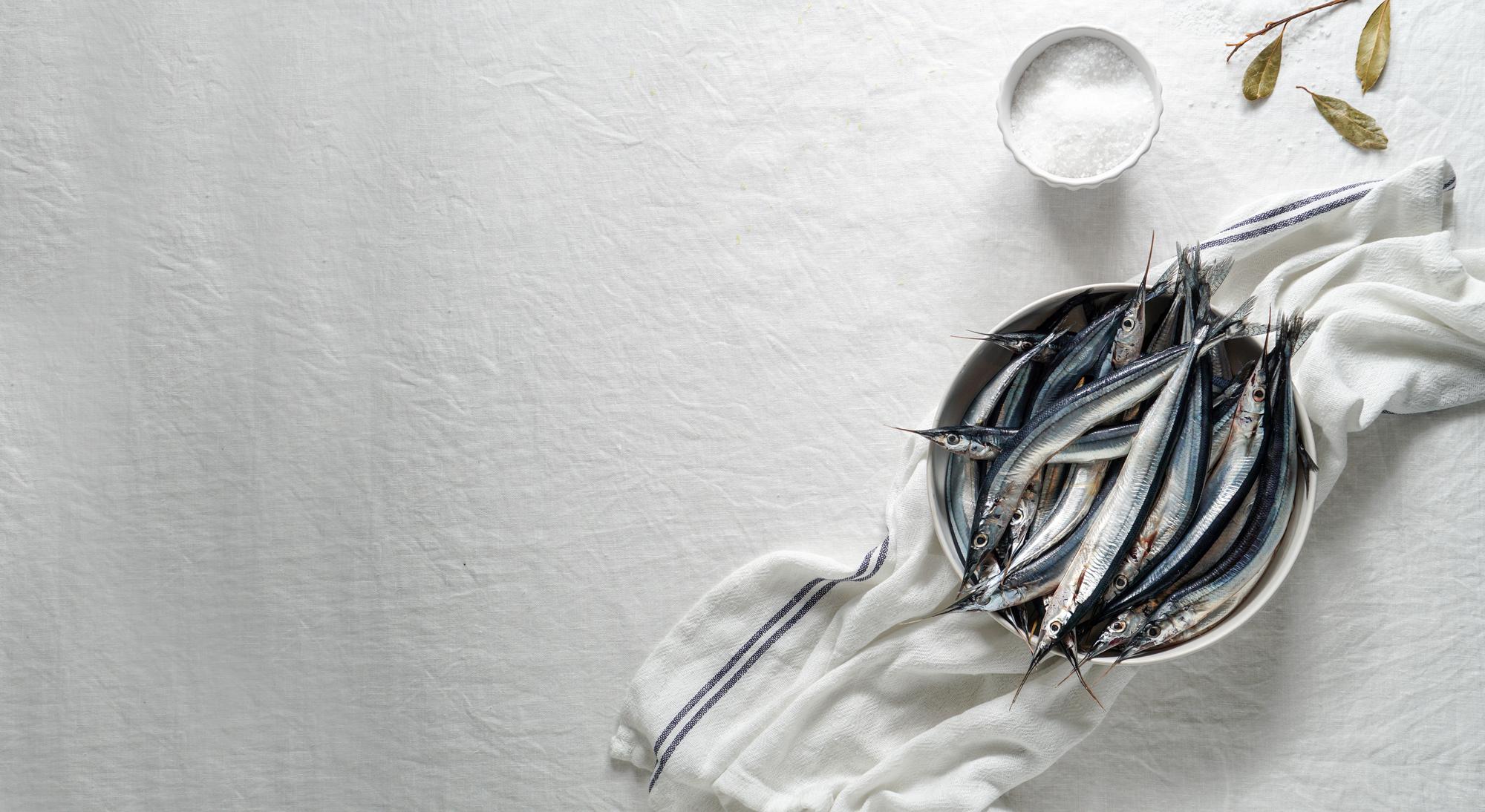 arrangement of tasting spoons and small plates on linen